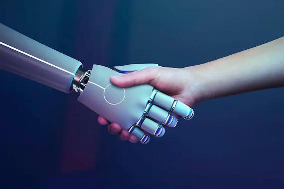 Apreton de mano humana y mano robotica